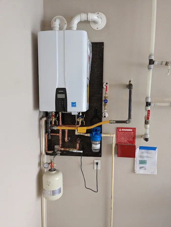 Professional plumber installing copper piping in a Hobbs home